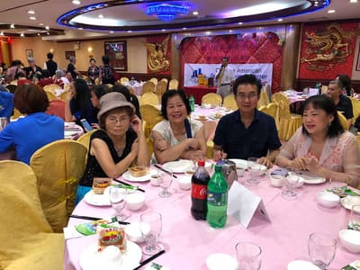 Residents enjoying a meal at a dining event.