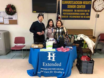 Staff members at a community event with food