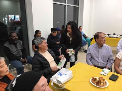 Residents and staff interacting in a social setting