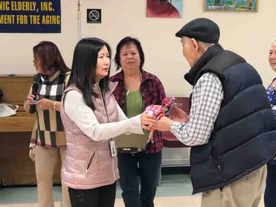 Residents exchanging gifts during an activity