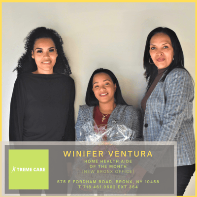 Staff member recognition event with three women