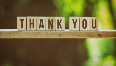 Wooden blocks spelling 'THANK YOU'