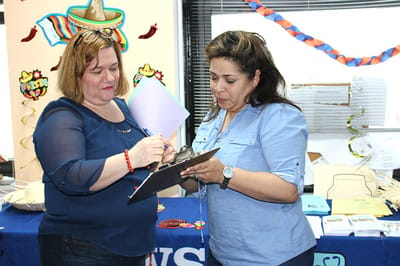 Two staff members collaborating at a table