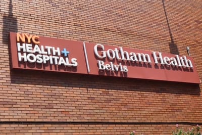 Signage for Gotham Health on a building exterior