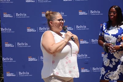 Speaker addressing an outdoor gathering event