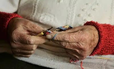 Close-up of elderly hands crocheting