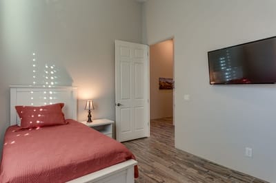 Private resident room with a bed and TV