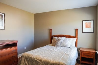 Cozy private resident room with wooden furniture