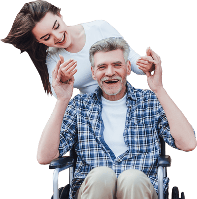 Happy elderly man in wheelchair with caregiver.