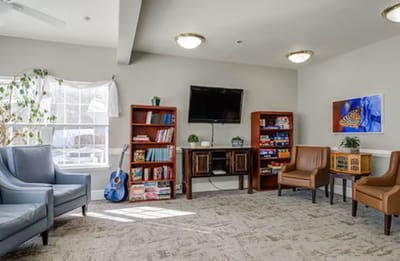 Common area with seating and bookshelf