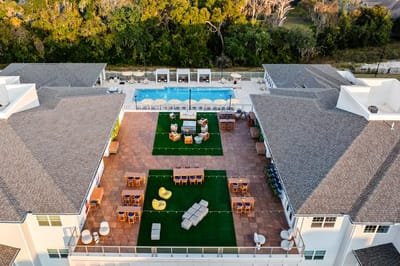 Aerial view of outdoor seating area and pool.