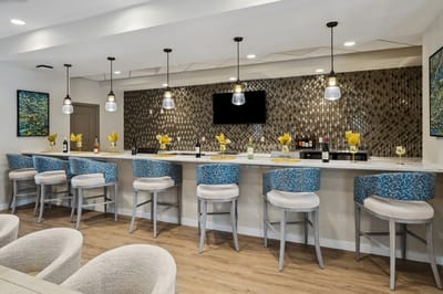 Stylish bar area with seating and modern decor