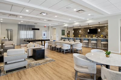 Interior common area with seating and a bar.