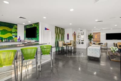 Modern common area with seating and decor.