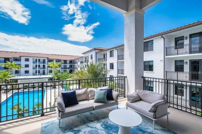 Balcony view overlooking pool and courtyard