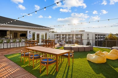 Outdoor space with seating and lighting.