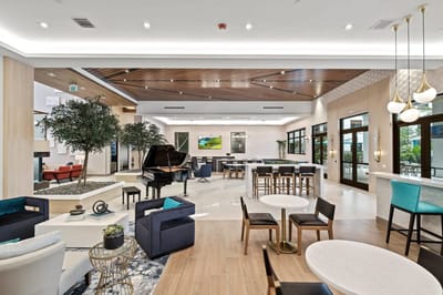 Spacious common area with piano and seating
