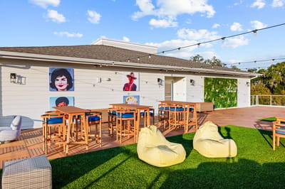 Outdoor common area with seating and art.