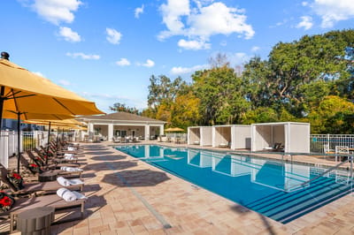 Resort-style pool area with lounge chairs