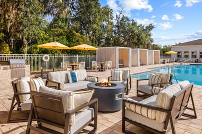 Outdoor patio seating area by the pool