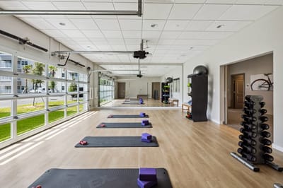 Interior view of a fitness room with exercise mats
