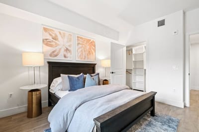 Cozy bedroom with modern decor and natural light.