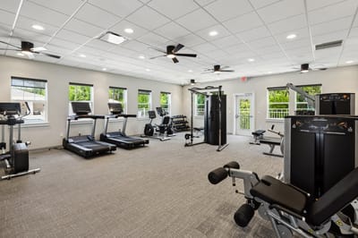 Well-equipped fitness room with exercise machines