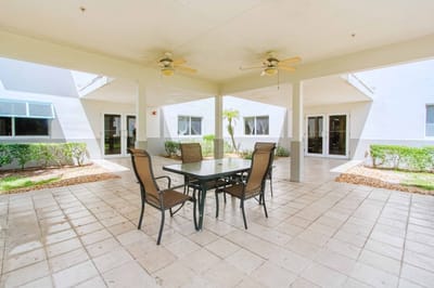 Outdoor seating area with tables and chairs