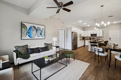 Stylish common area with seating and kitchen.