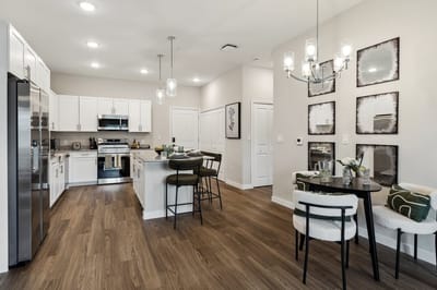 Modern kitchen and dining area in a facility.