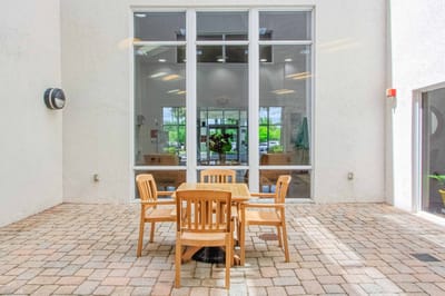 Interior common area with seating and large windows.
