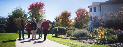 Residents enjoying a walk in the garden area