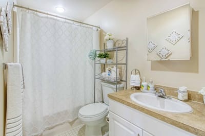 Clean and bright bathroom with white decor.