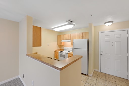 Cozy apartment kitchen space in light colors.