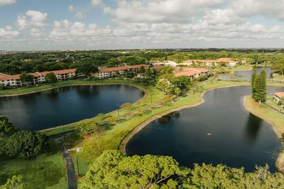 Aerial view of the landscaped grounds and water features.