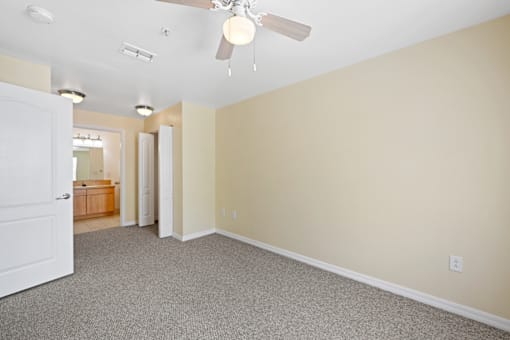 Empty resident room with light-colored walls.
