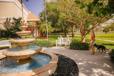 Residents enjoying the outdoor courtyard with a fountain