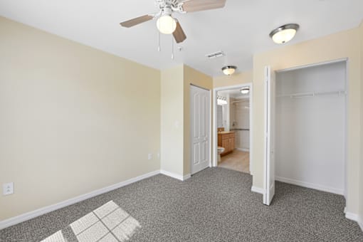 Empty resident room with light-colored walls.