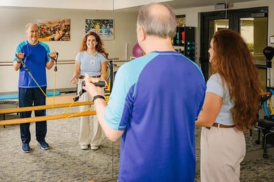 Residents and staff engaging in exercise therapy.