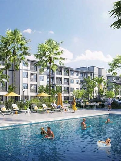 Outdoor pool area with residents enjoying the sun.