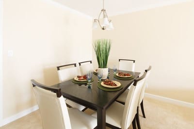 Dining table set with meal plates and decor
