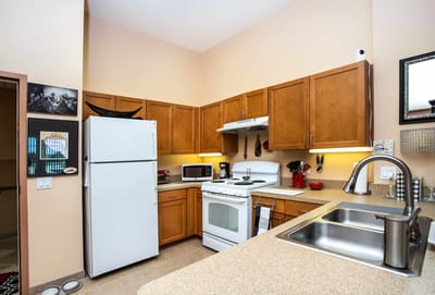 Kitchen area with appliances and cabinets