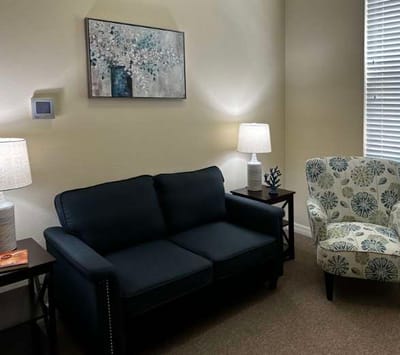 Cozy sitting area with a couch and artwork