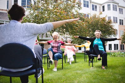 Seniors participating in an outdoor exercise class.