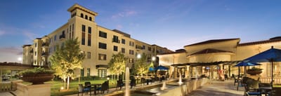 Exterior view of the assisted living facility at dusk.