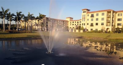 Exterior view of the facility with a water fountain