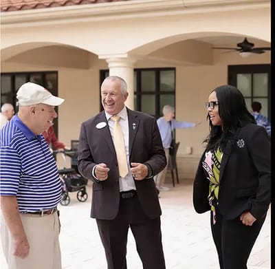 Residents and staff interacting outdoors
