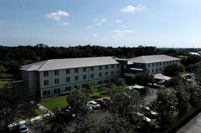 Aerial view of the facility building and grounds.