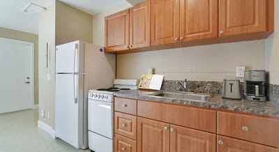 Well-equipped kitchenette in a resident's apartment.
