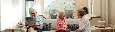 Residents chatting in a cozy common area